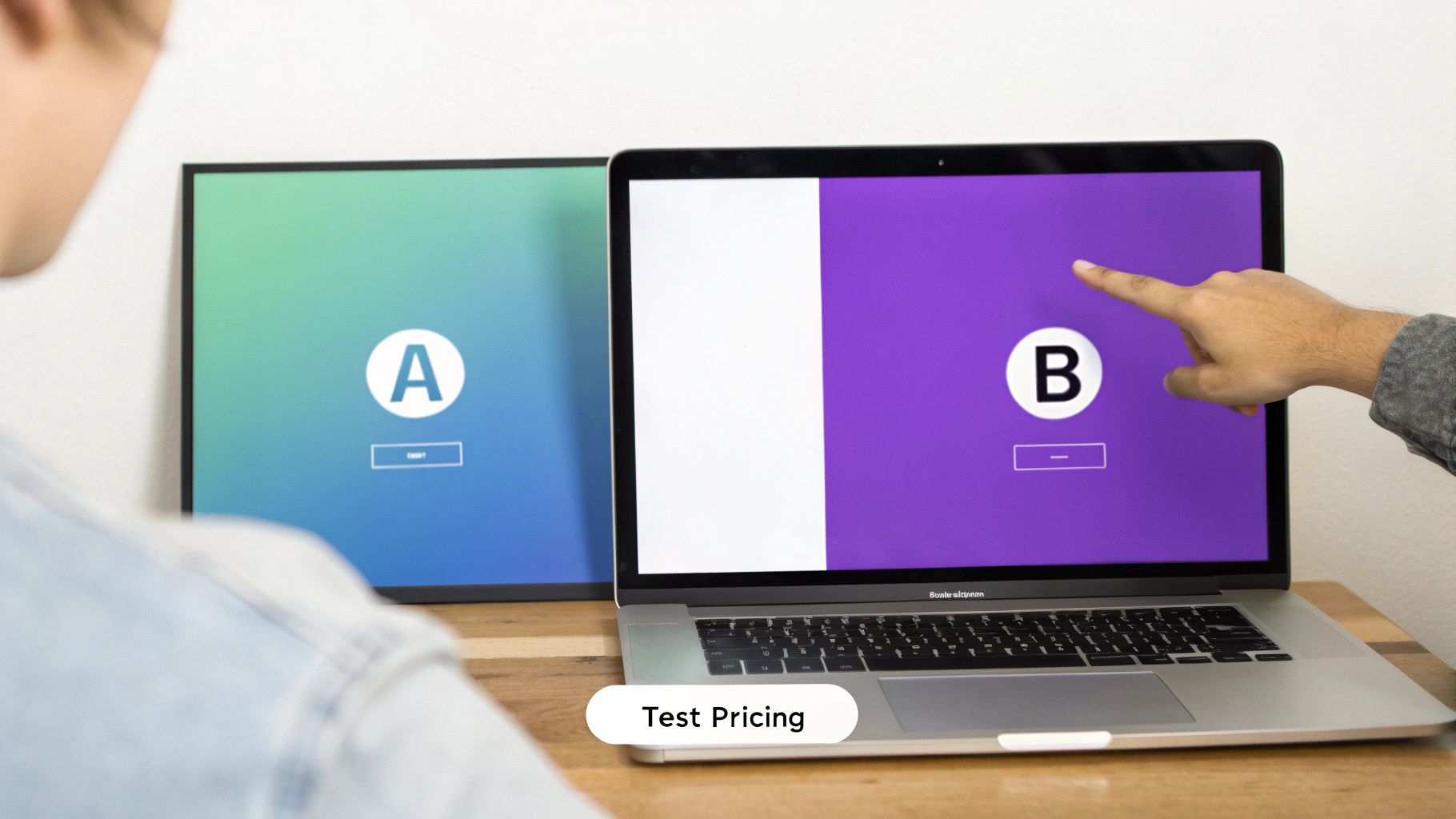 A person at a desk looking at a computer screen with a question mark bubble above their head, representing common questions.